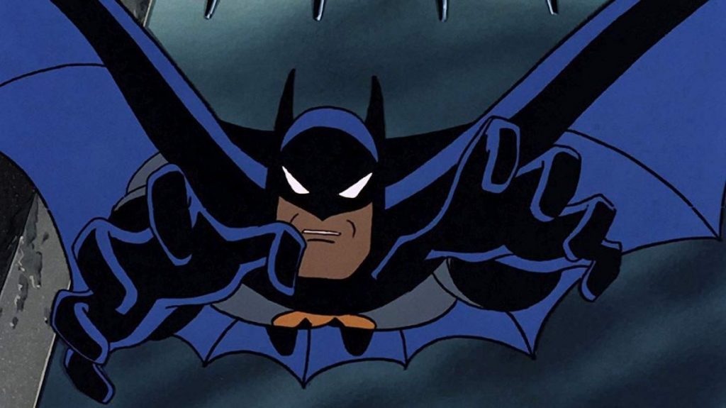 A screenshot from Batman: The Animated Series. Batman dives towards the camera with hands out.